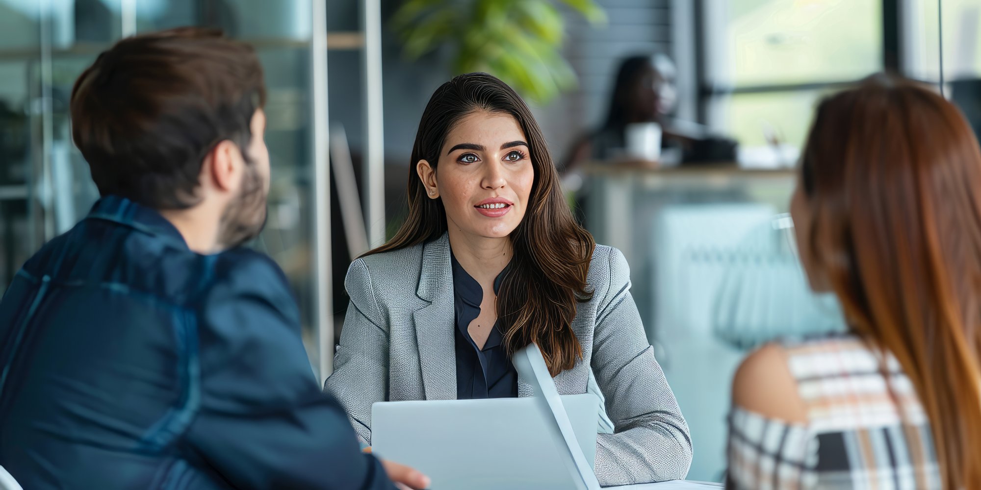 latin-business-consultant-advising-social-enterprise-impact-measurement-contemporary-office